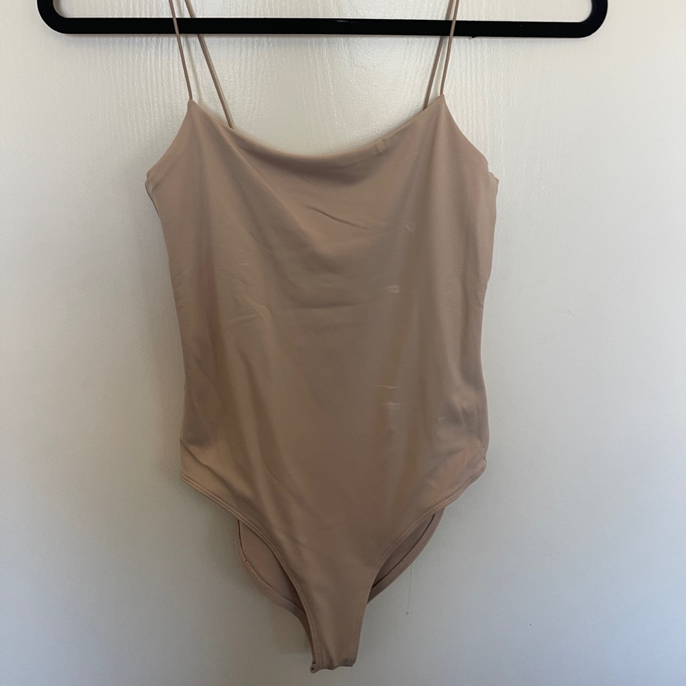 tan body suit